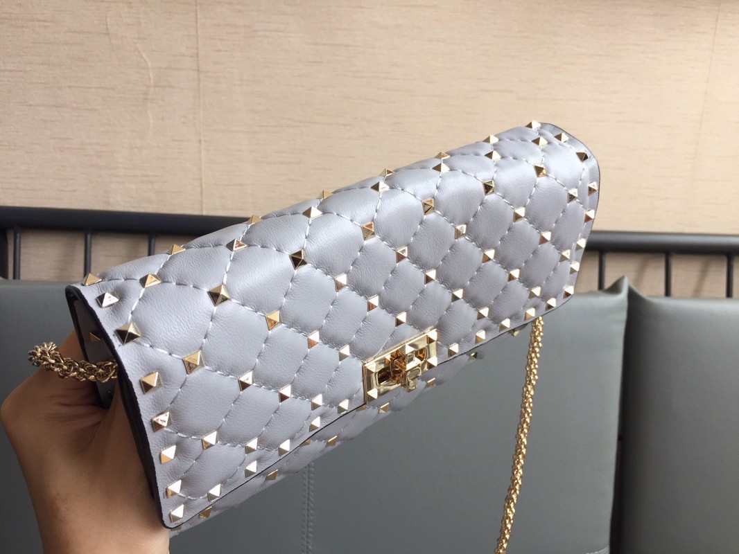 Valentino Rockstud Spike Crossbody Clutch Bag In Blue Lambskin