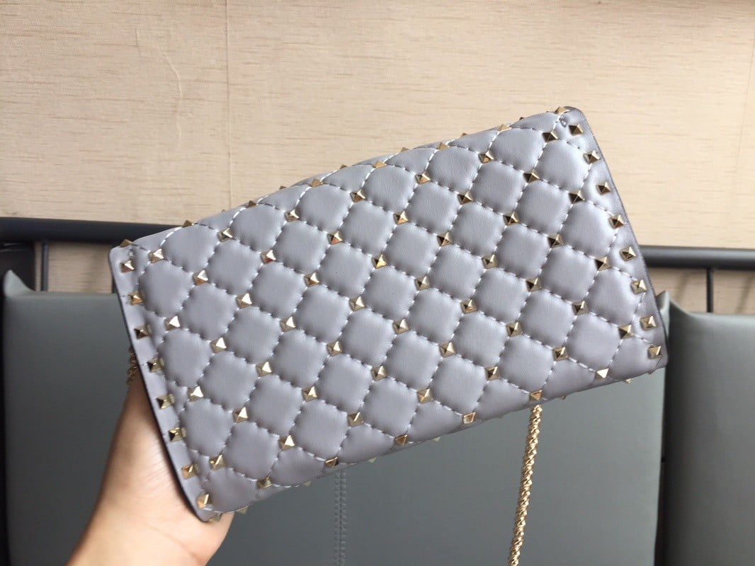 Valentino Rockstud Spike Crossbody Clutch Bag In Blue Lambskin