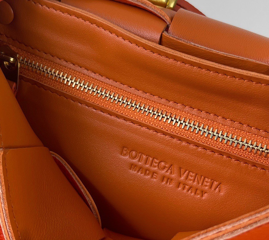 Bottega Veneta Cassette Bag In Maple Grained Intreccio Calfskin