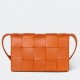 Bottega Veneta Cassette Bag In Orange Intreccio Lambskin