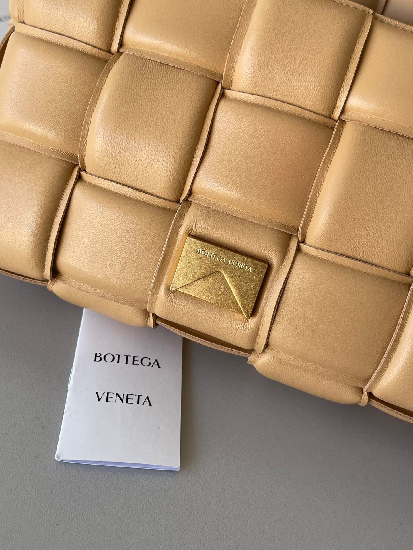 Bottega Veneta Padded Cassette Bag In Almond Intrecciato Lambskin