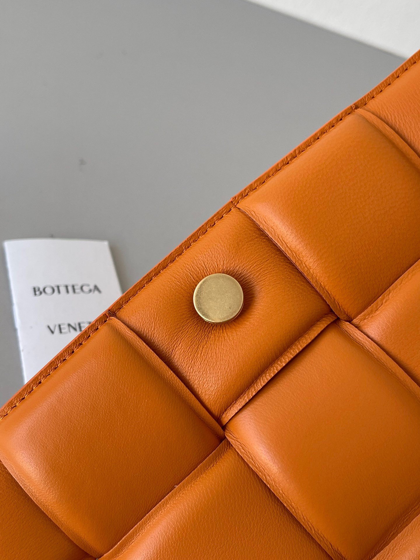 Bottega Veneta Padded Cassette Bag In Orange Intrecciato Lambskin