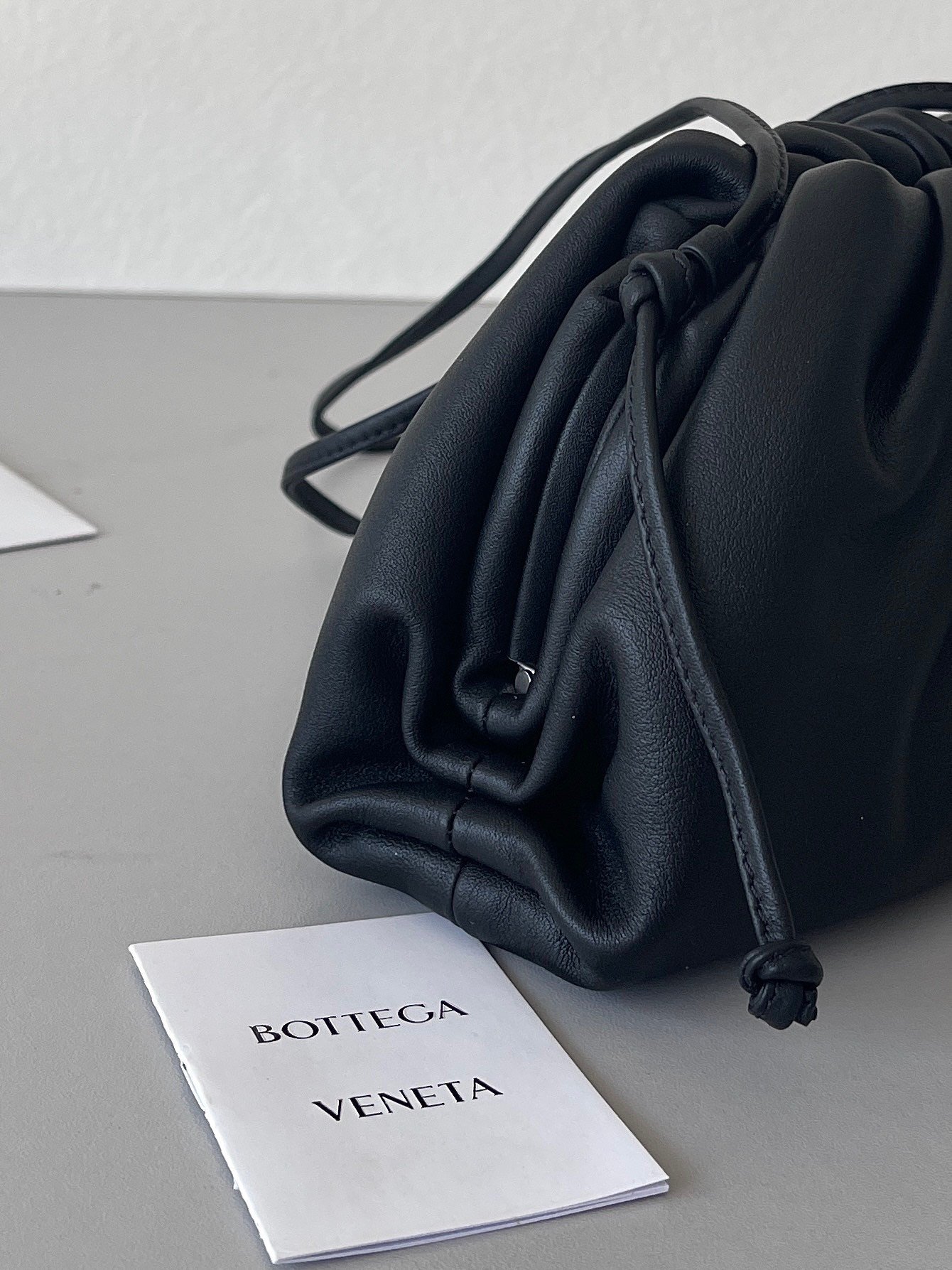 Bottega Veneta Mini Pouch with Strap in Black Calfskin