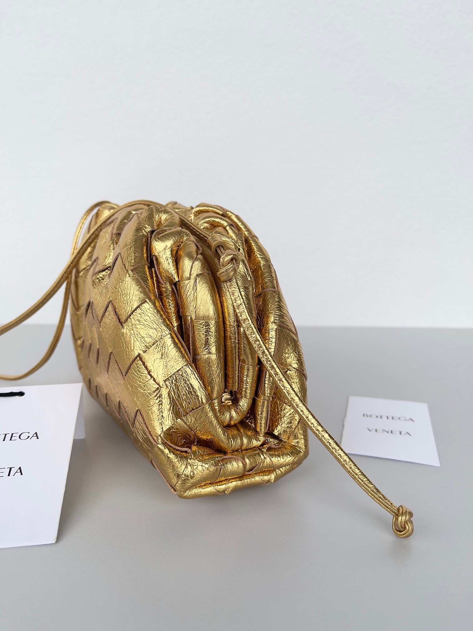 Bottega Veneta Mini Pouch with Strap in Gold Metallic Lambskin