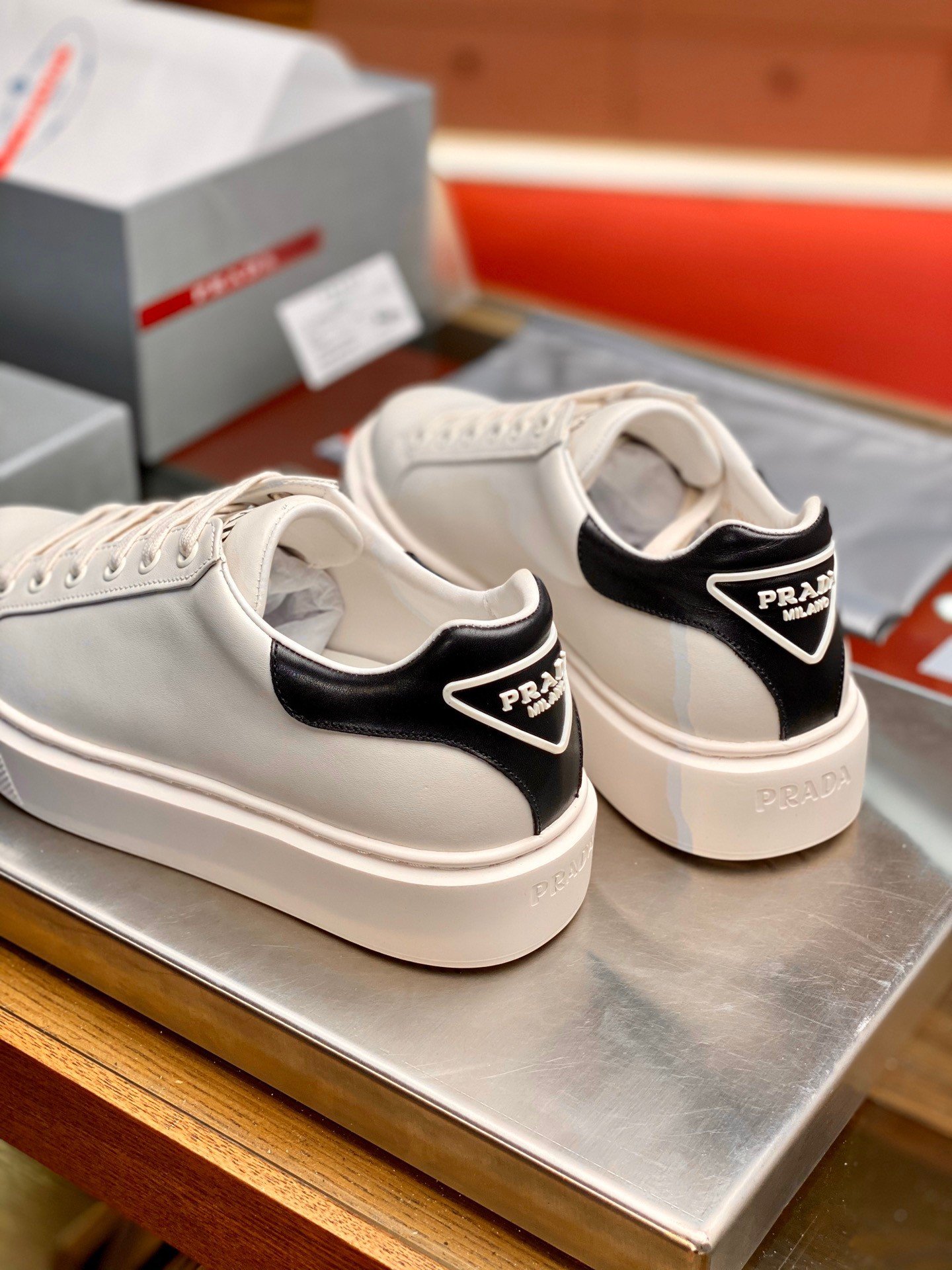 Prada Women's Macro Sneakers In White and Black Leather