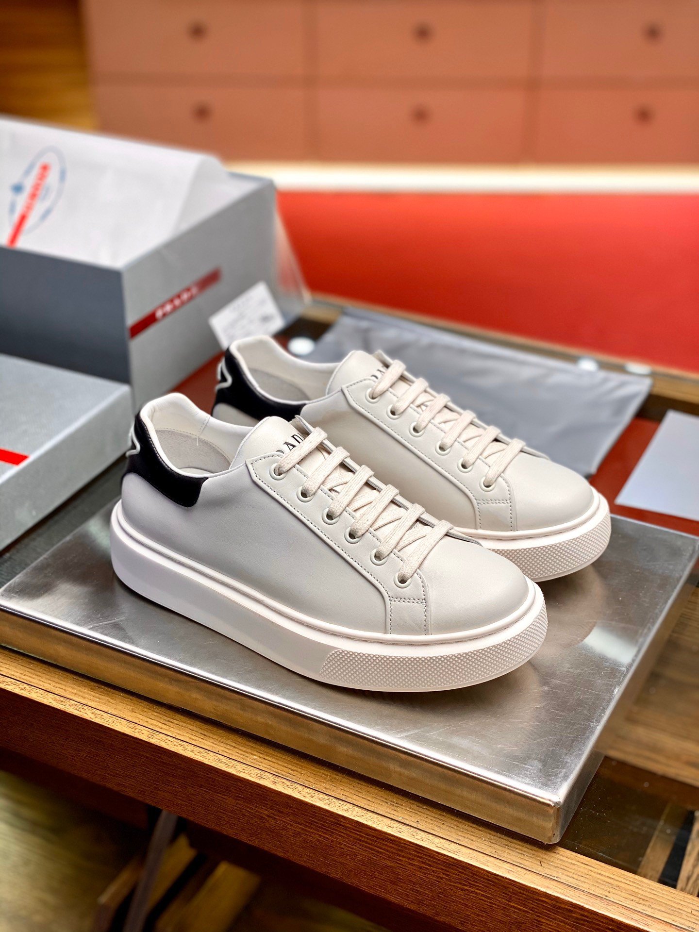 Prada Women's Macro Sneakers In White and Black Leather