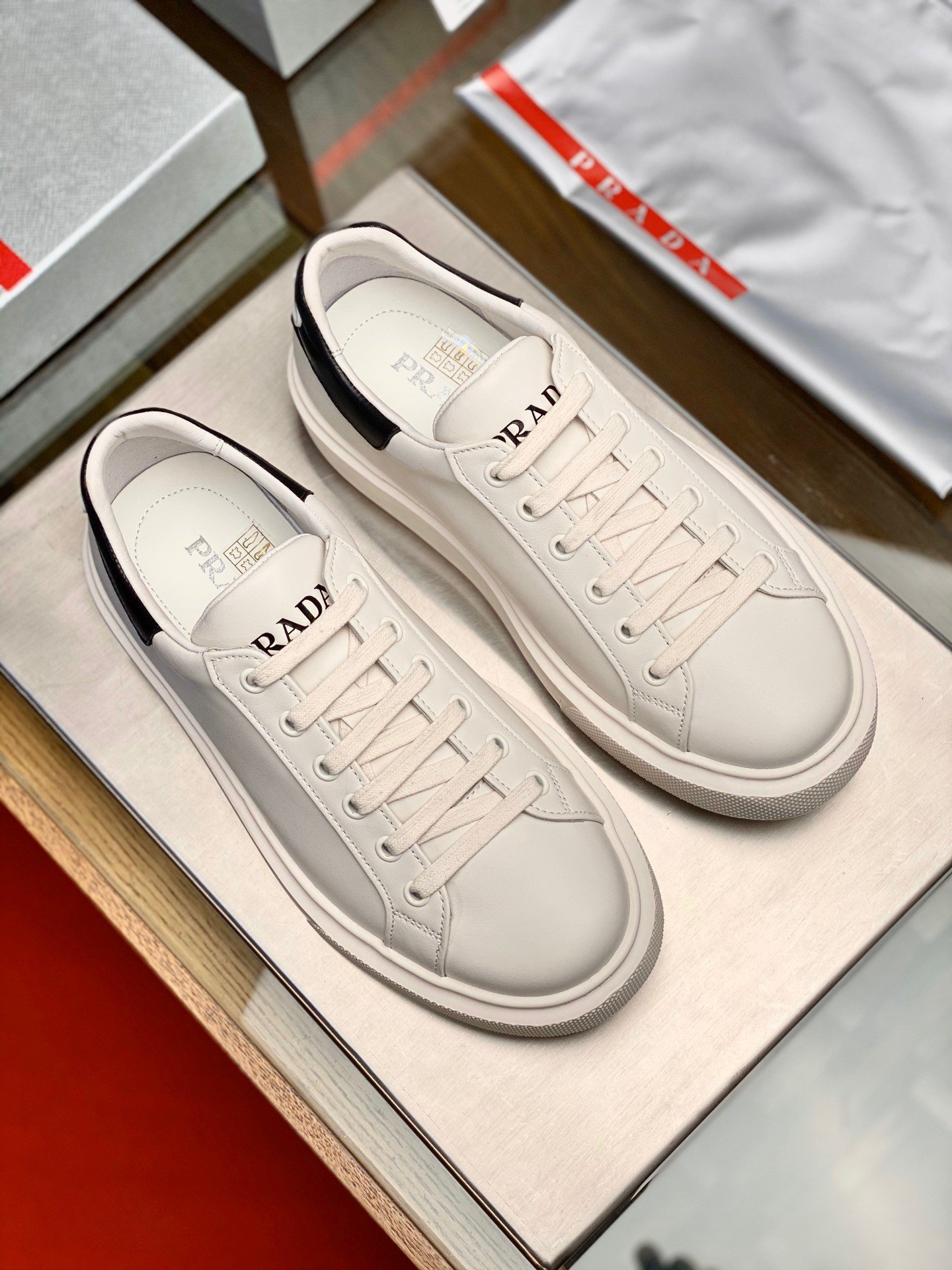 Prada Women's Macro Sneakers In White and Black Leather