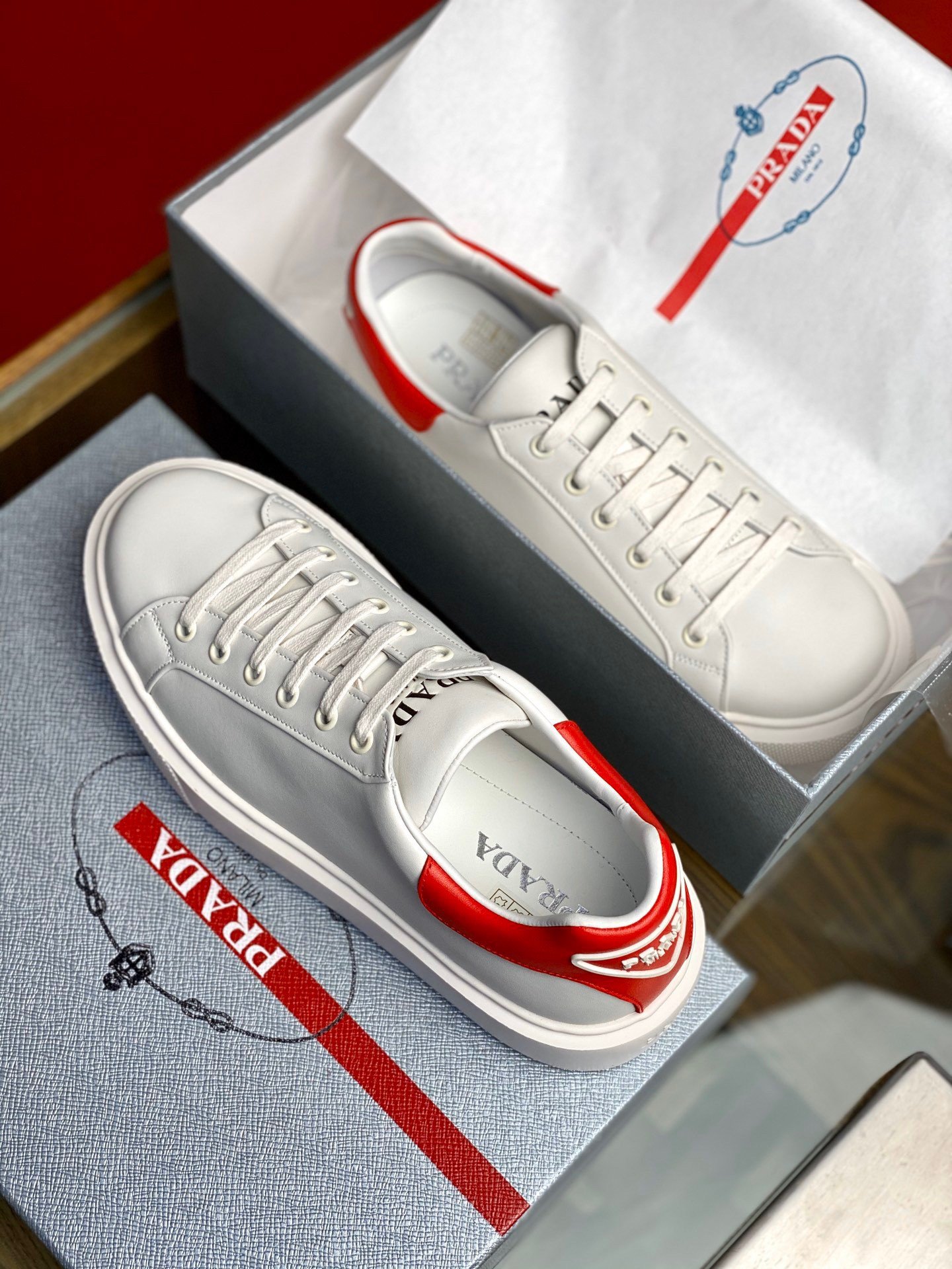 Prada Women's Macro Sneakers In White and Red Leather