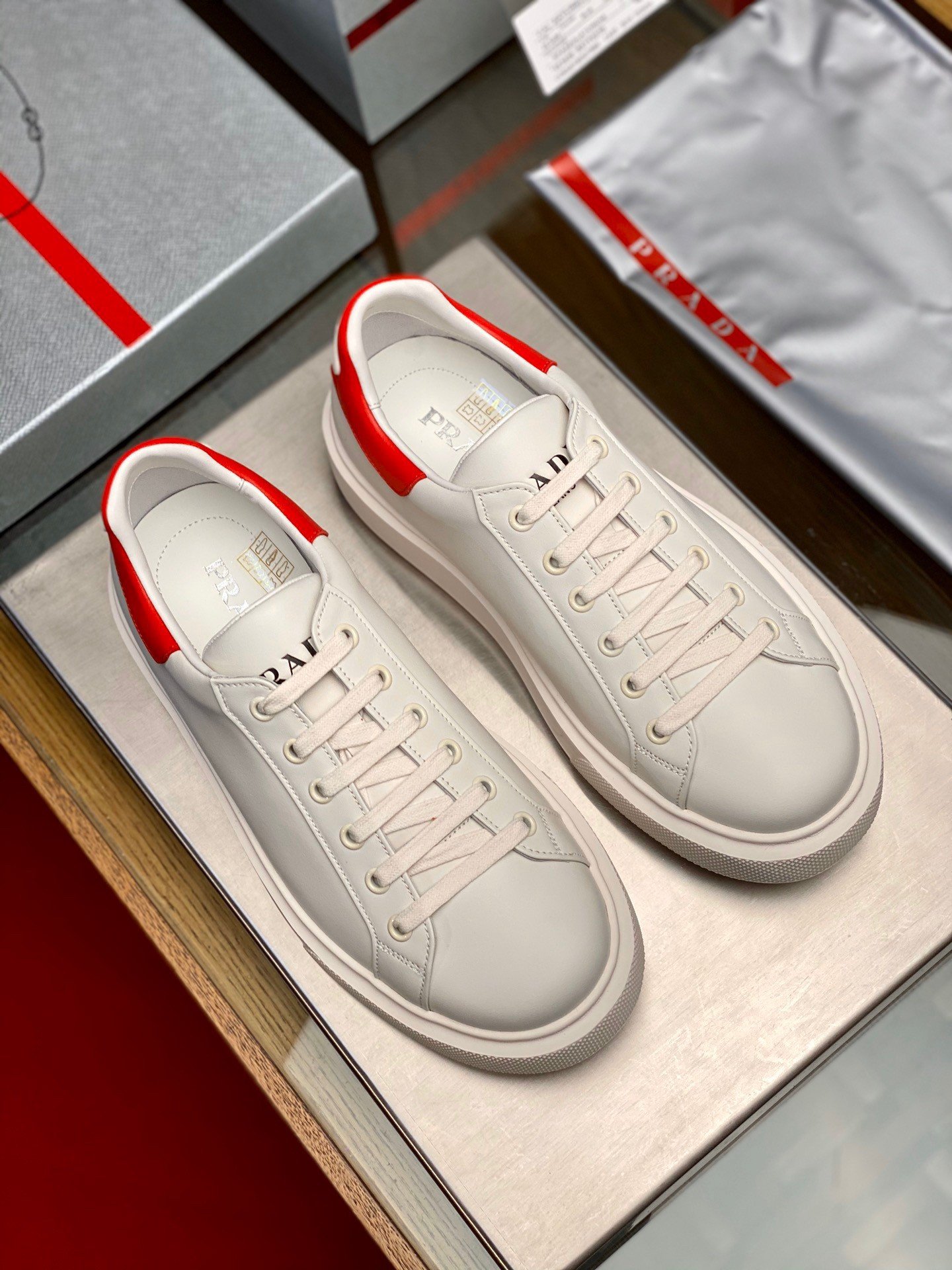 Prada Women's Macro Sneakers In White and Red Leather