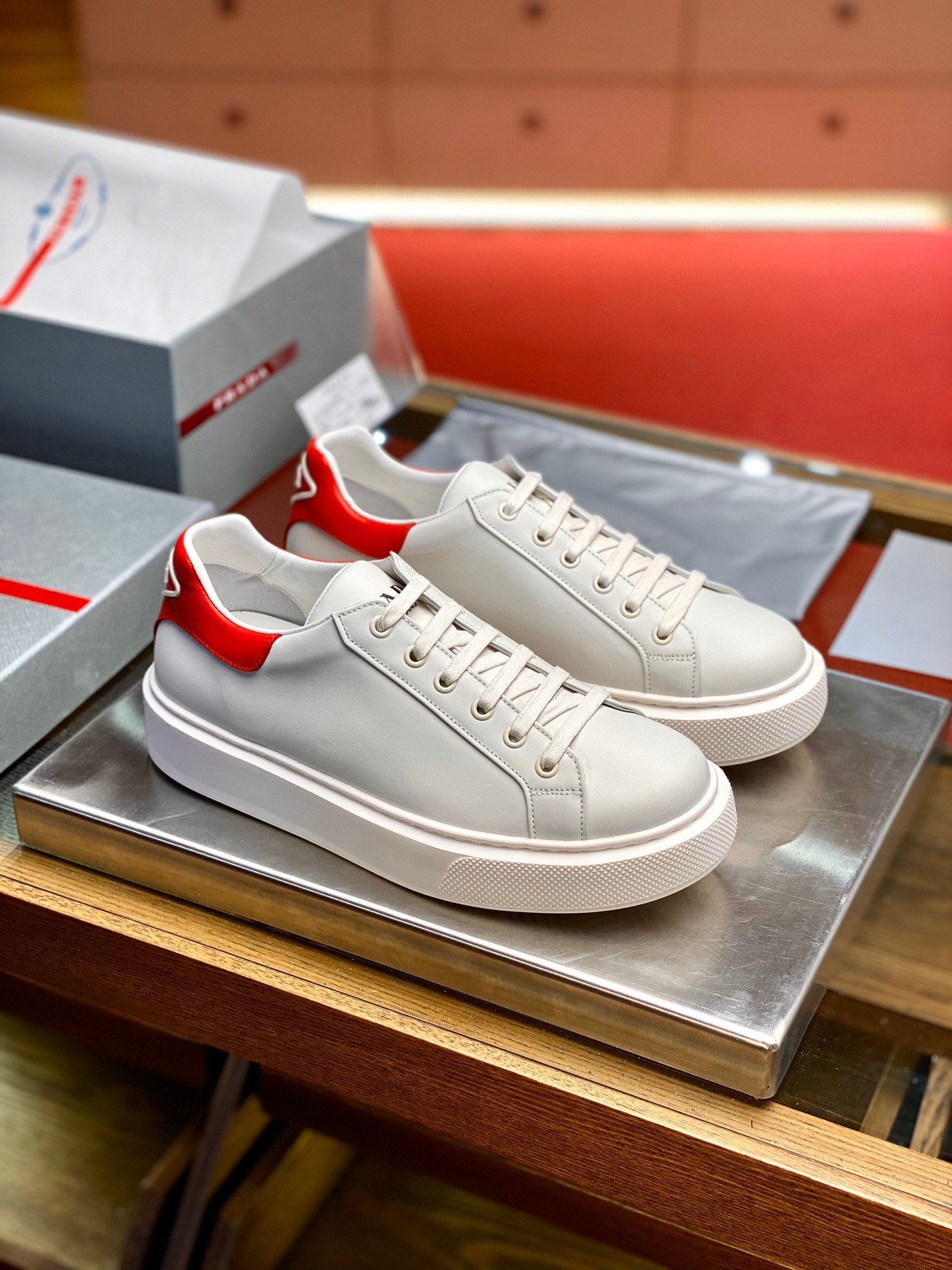 Prada Women's Macro Sneakers In White and Red Leather