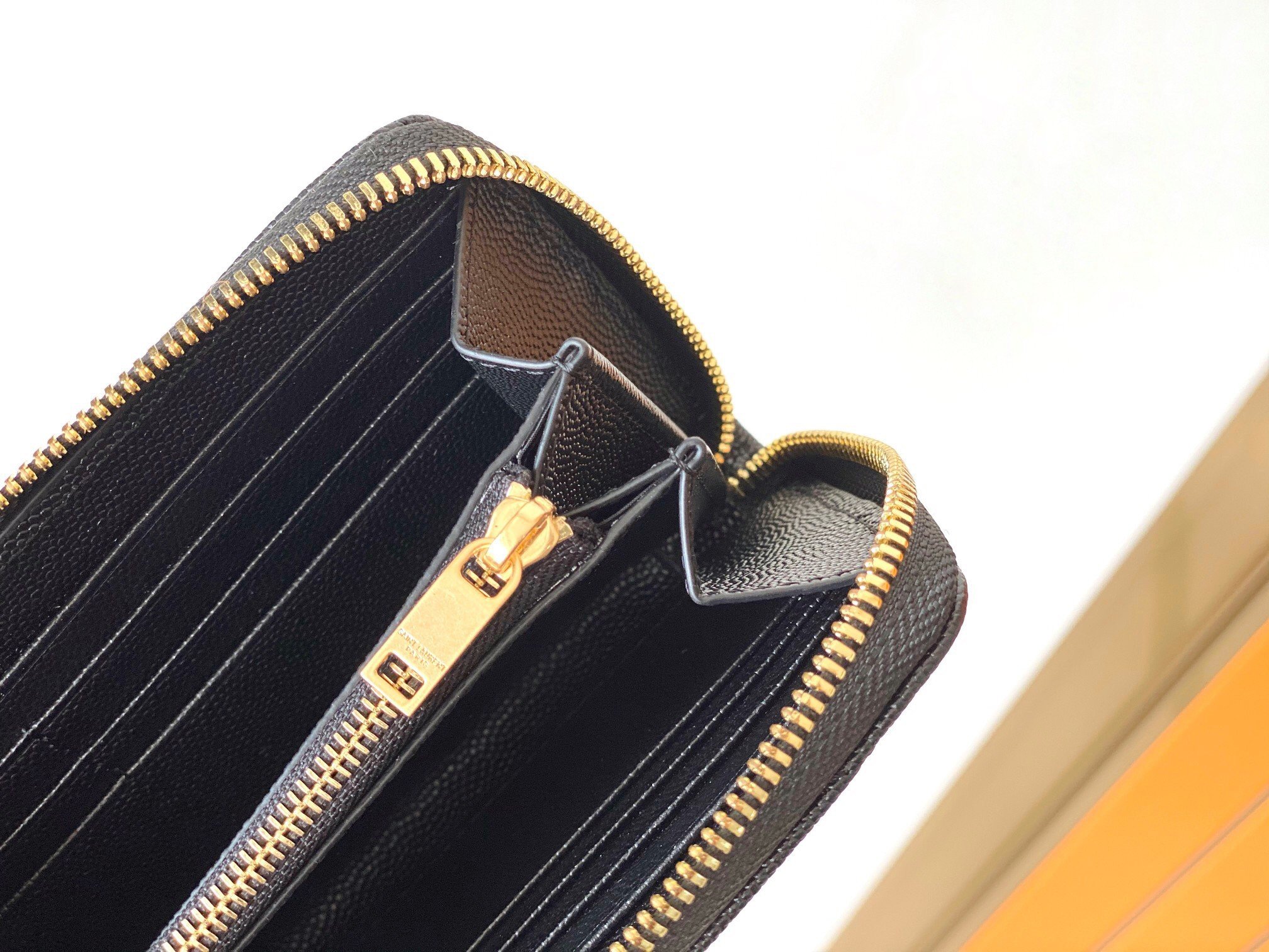 Saint Laurent Cassandre Zip Around Wallet in Black Matelasse Leather