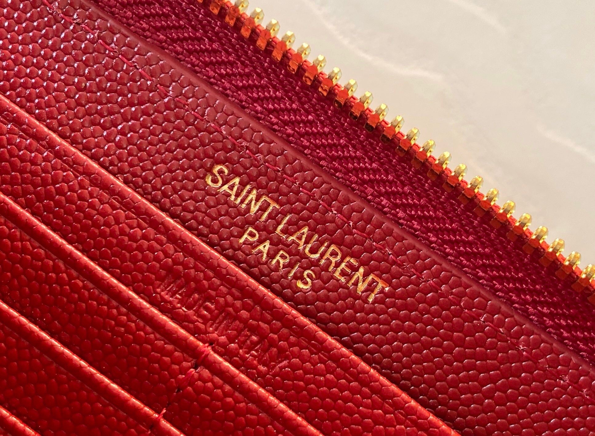 Saint Laurent Cassandre Zip Around Wallet in Red Matelasse Leather