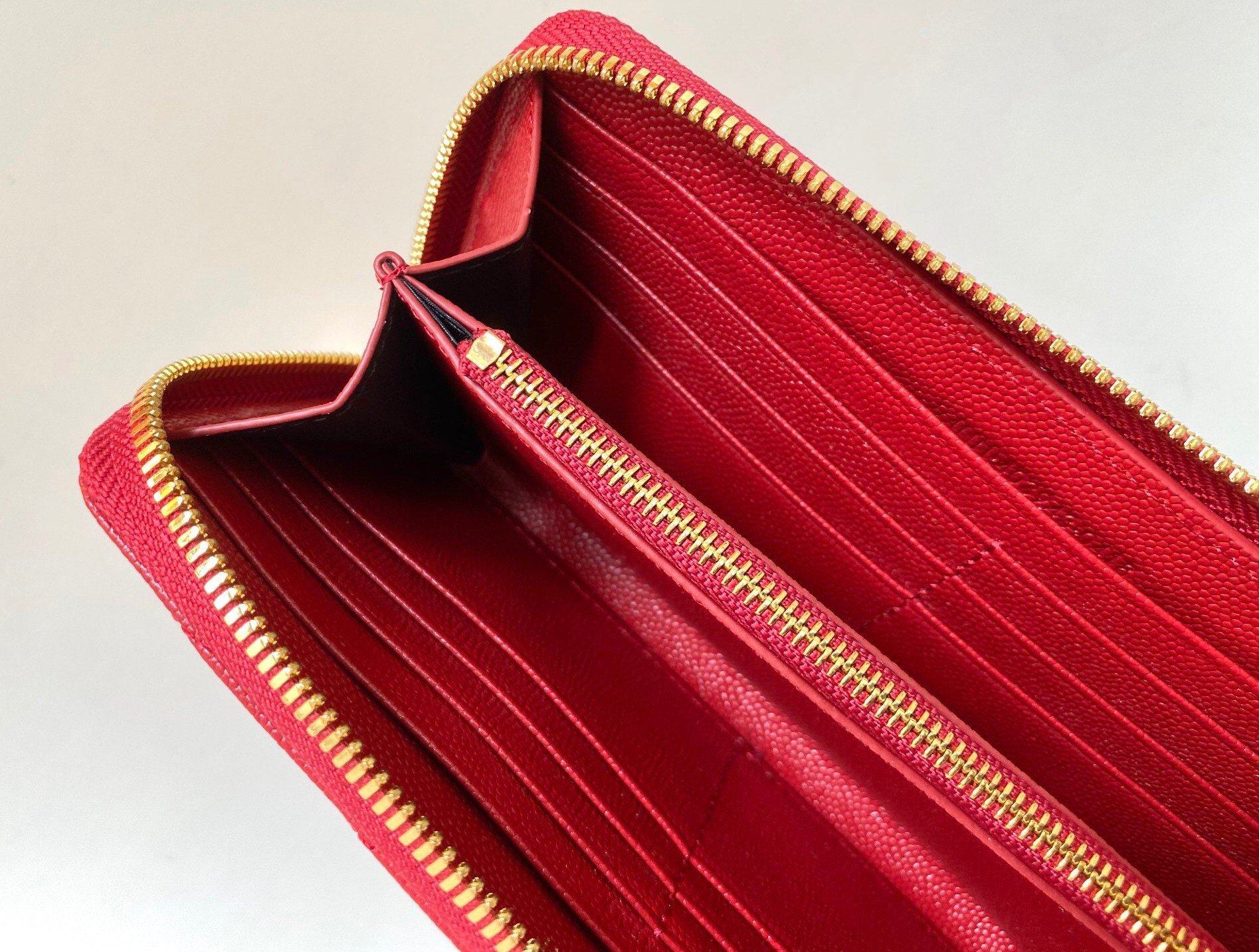 Saint Laurent Cassandre Zip Around Wallet in Red Matelasse Leather