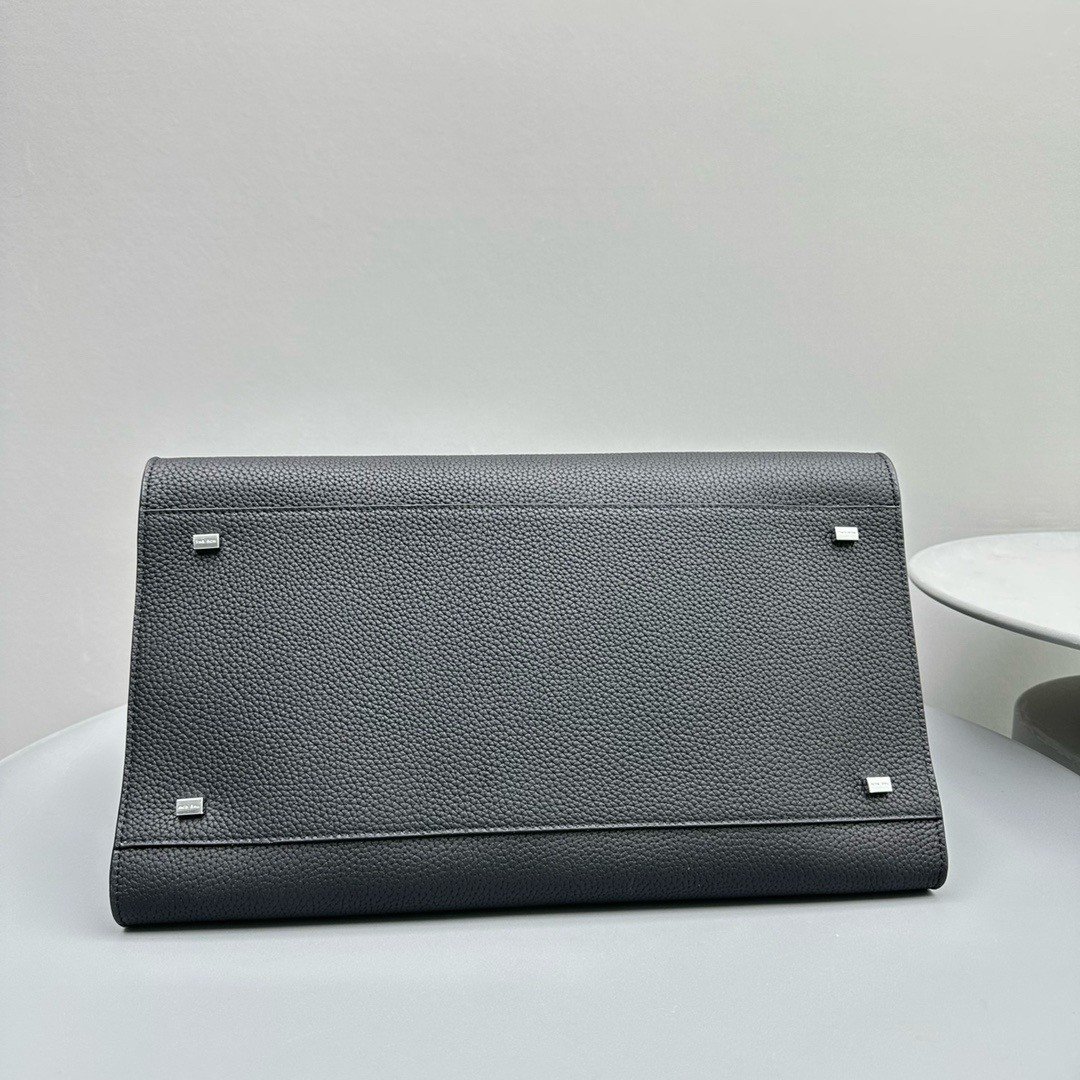 The Row Margaux 15 Top Handle Bag in Black Grained Leather