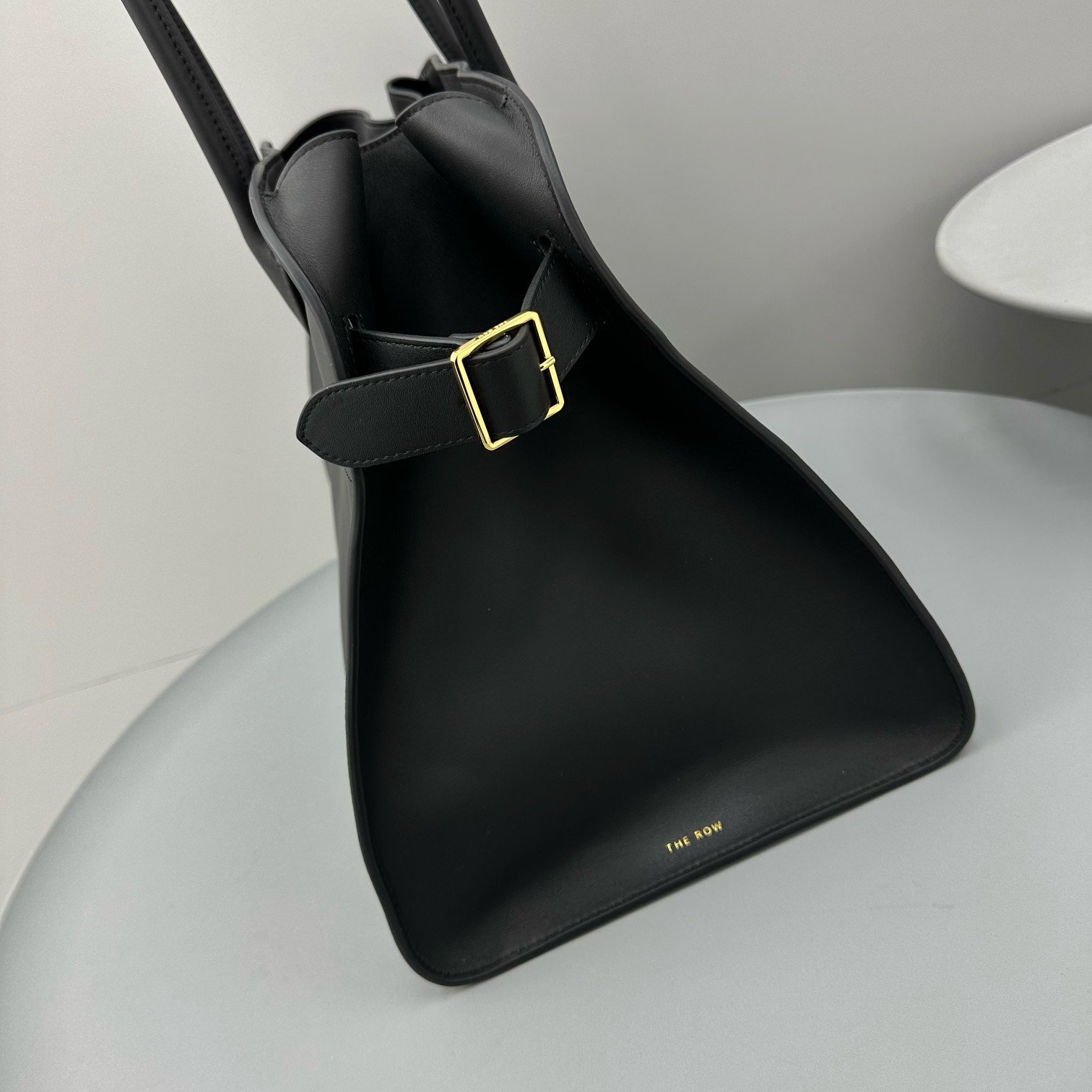 The Row Margaux 17 Top Handle Bag in Black Leather