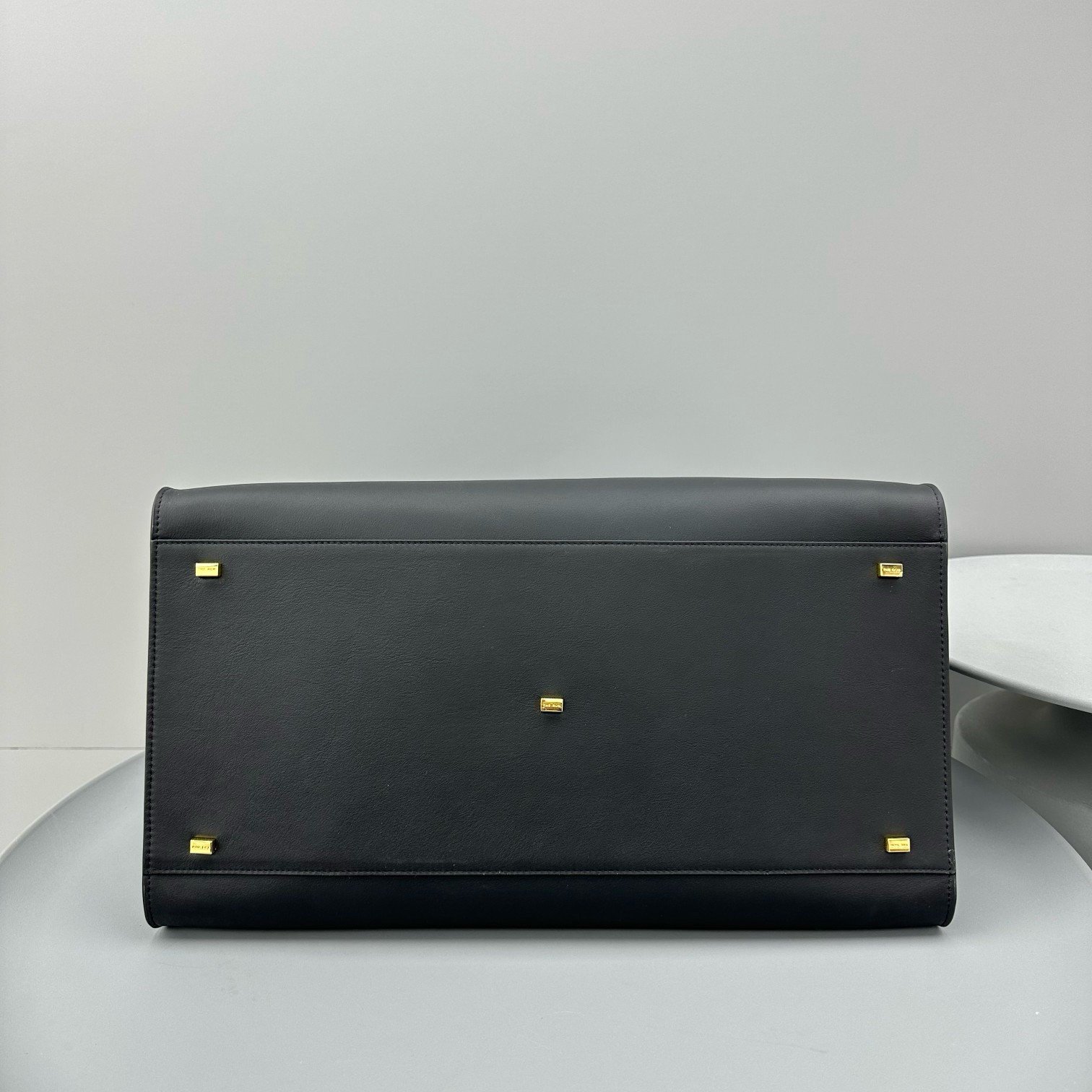 The Row Margaux 17 Top Handle Bag in Black Leather