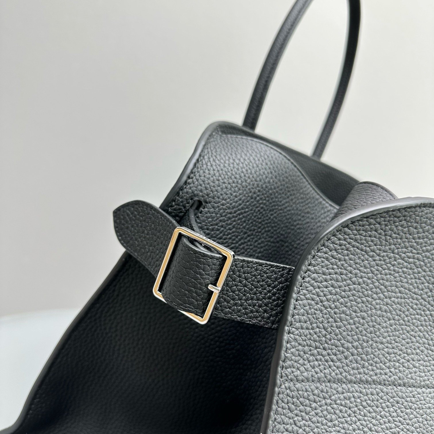 The Row Margaux 17 Top Handle Bag in Black Grained Leather